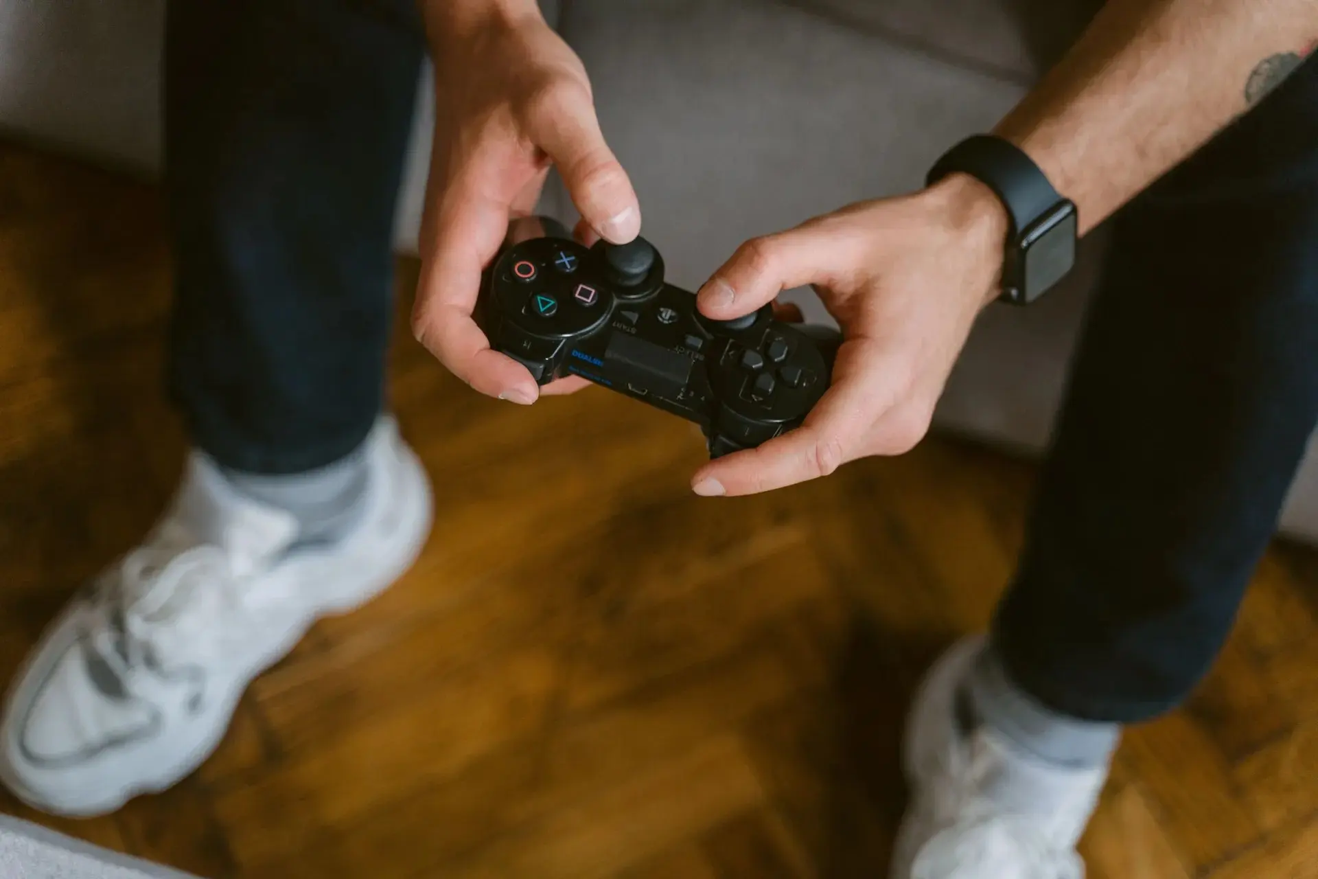 Playing cards and a game controller on a table